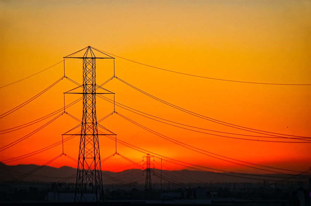 transmission towers during golden hour